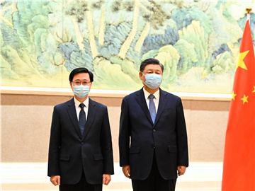 习近平会见李家超